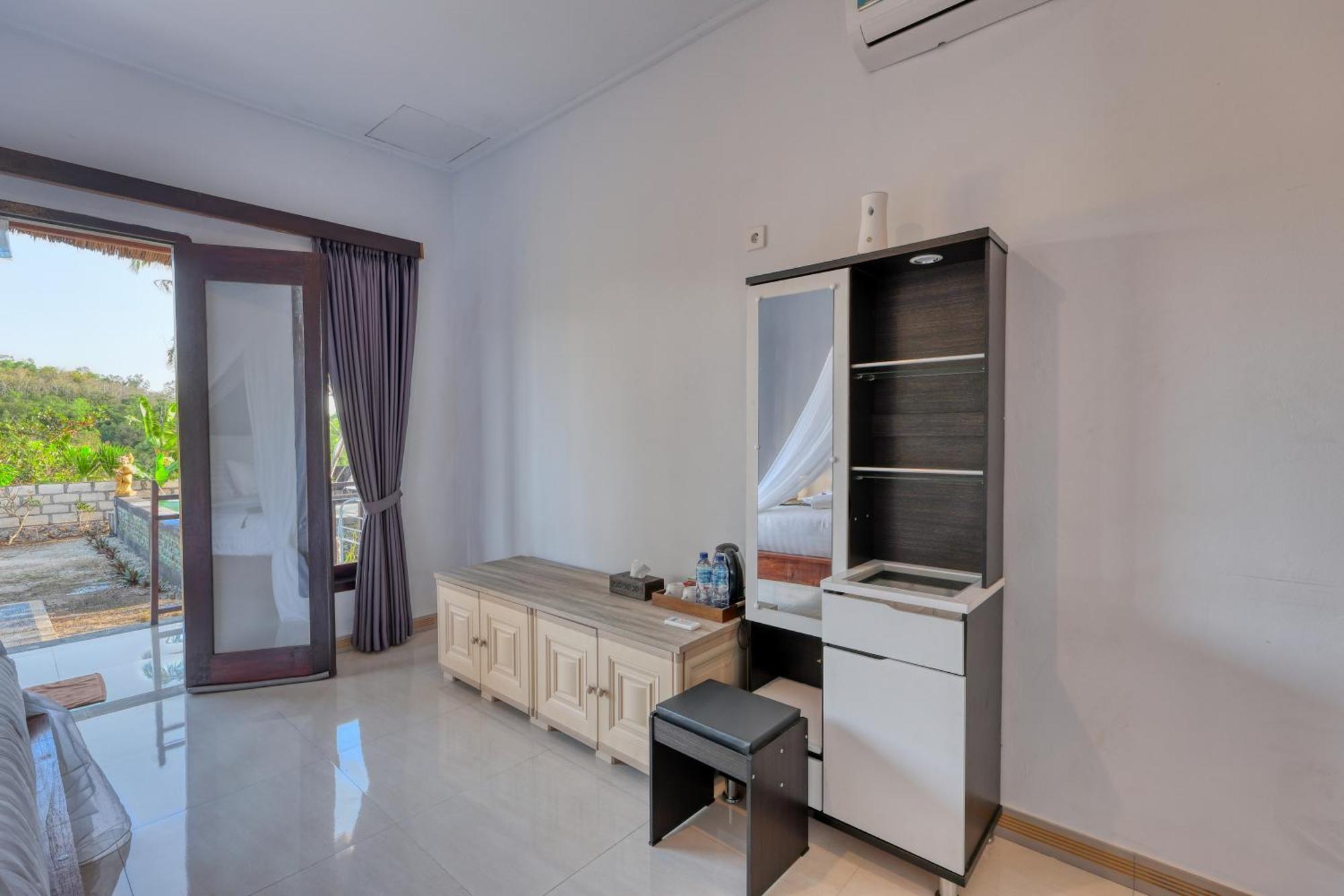 Mt Penida Bungalow Sakti Rom bilde